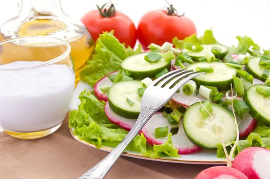 Radish salad on plate with fork