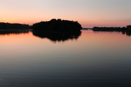 View reservoir after sunset in the quiet weather. Khmelnitsky, Ukraine