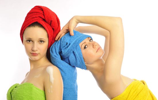 beautiful young women in towel on white background