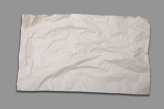 Old crumpled paper on gray background 