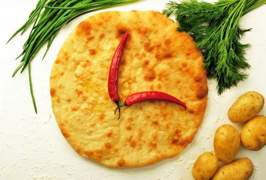 food composition made of flat cake, potato, cayenne, parsley and spring onion