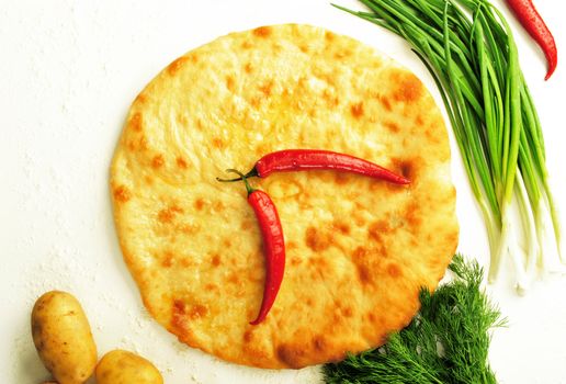   food composition made of flat cake, potato, cayenne, parsley and spring onion