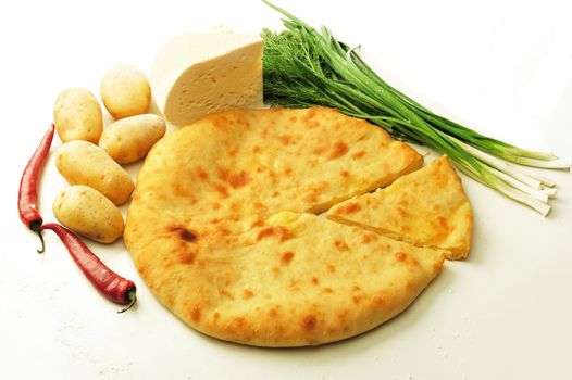 food composition made of flat cake, potato, cayenne, parsley and spring onion