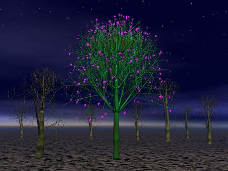 Beautiful green and pink strange tree in a forest of dead tress by night
