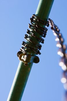 Old swing chain wrapped around the top post.