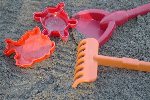 colorful plastic toys in a sandbox