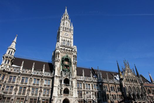 Munich- City Hall ;Marienplatz (Town Hall) with its mechanical clock, or Glockenspiel, in Munich, Germany............