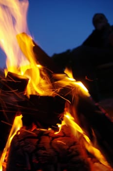 a nice campfire burning outside in summer