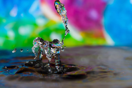 Macro photography of colorful abstract water drop creations.