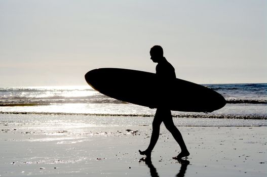 surfing at a nice beach outside at the sea