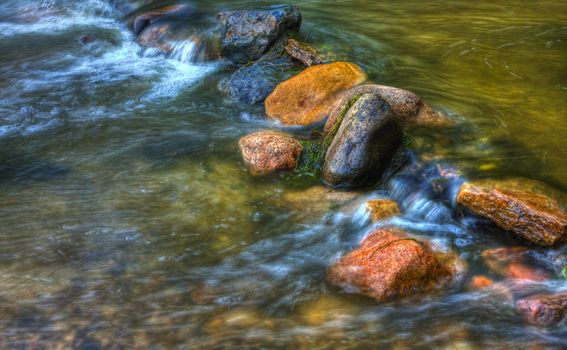 Rocks and rolling river in high dynamic range.