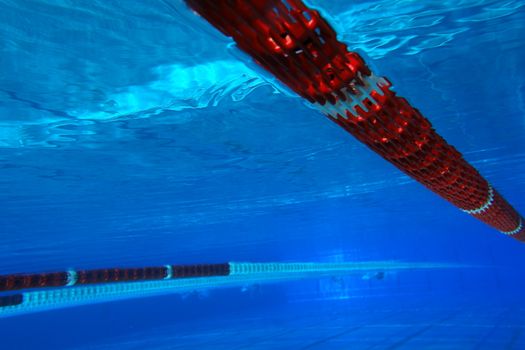 underwater view from a swimming pool with red marking