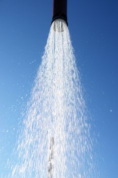 water drops falling from a shower outside