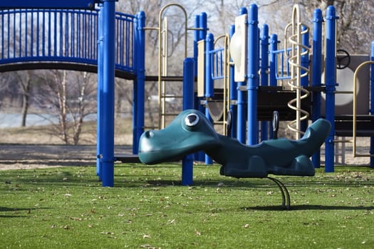 An Outside children's playground in the park.