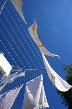 fresh washed laundry on rotary clothes dryer