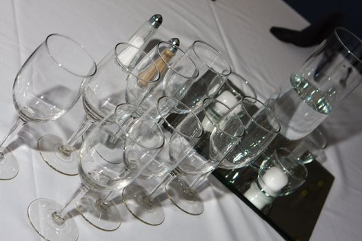 Photo of glass goblets on the table.
