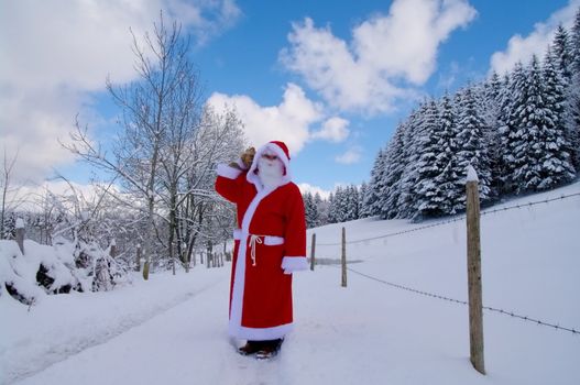 Santa Claus, Father Christmas in a beautiful winter landscape