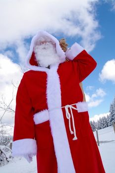 Santa Claus, Father Christmas in a beautiful winter landscape