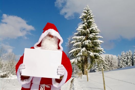 Santa Claus, Father Christmas holding blank sign