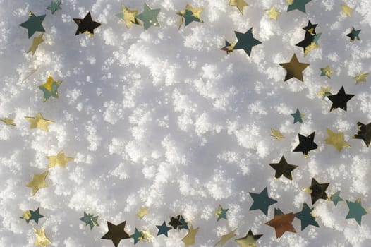 golden snow stars on a real snowy icy surface