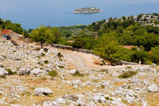 Montenegro, Balkans, Narrow gravel route to Skadarsko lake.