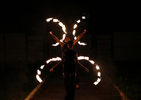 Beautiful dance with fire at night