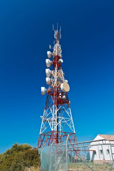 Communications tower with a beautiful blue sky