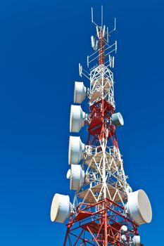 Communications tower with a beautiful blue sky