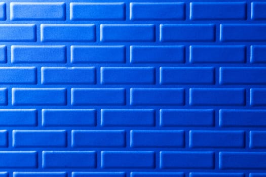 A wall formed by metal bricks