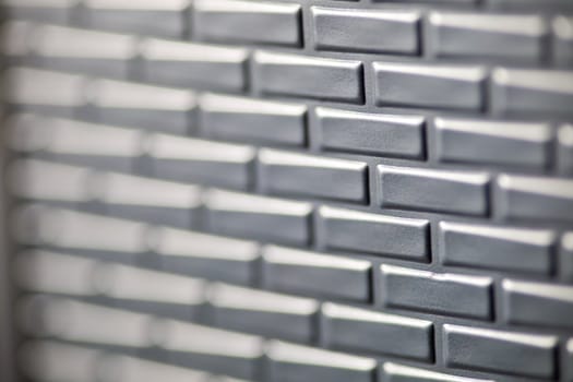 A wall formed by metal bricks