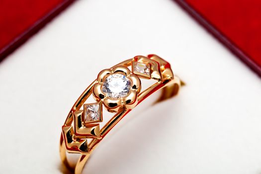Fantastic gold ring adorned with several white zirconia