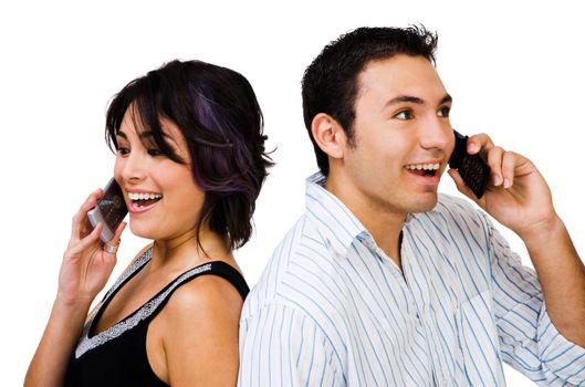 Smiling couple talking on mobile phones isolated over white