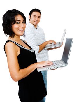 Smiling couple using laptops and posing isolated over white