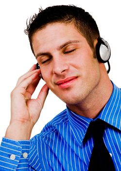 Man listening to music on a headphones and smiling isolated over white