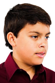 Close-up of a boy thinking isolated over white