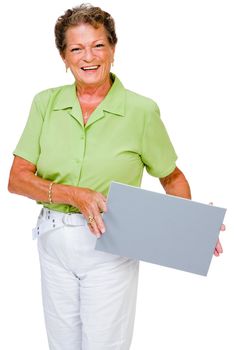 Confident woman showing a placard and smiling isolated over white