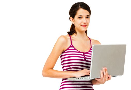 Portrait of a woman using a laptop and smiling isolated over white