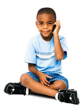 Smiling boy talking on a mobile phone isolated over white