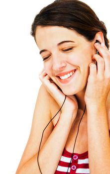 Close-up of a woman listening to music on earbud isolated over white