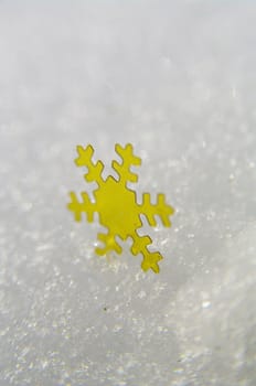 golden snow stars on a real snowy icy surface