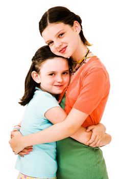 Happy girls hugging and posing isolated over white