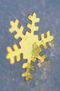 golden snow stars on a real snowy icy surface