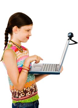 Close-up of a girl using a laptop and smiling isolated over white