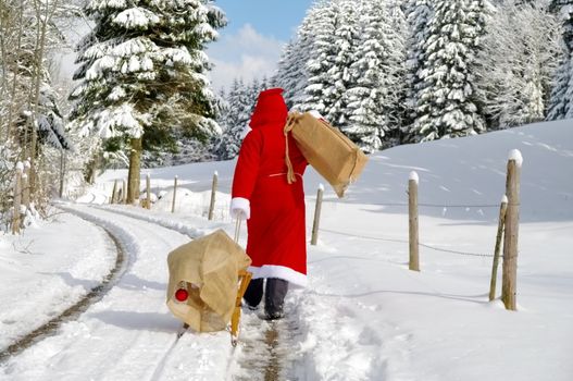 Santa Claus, Father Christmas in a beautiful winter landscape