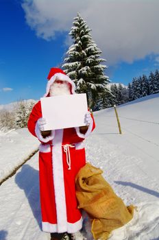 Santa Claus, Father Christmas holding blank sign