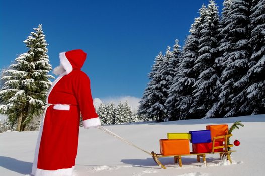 Santa Claus, Father Christmas with colorful presents on a sledge