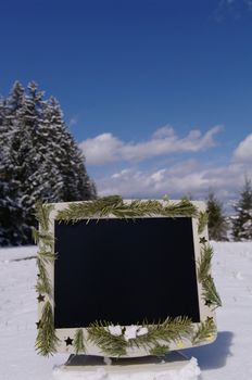 a decorated screen in snowy winter landscape