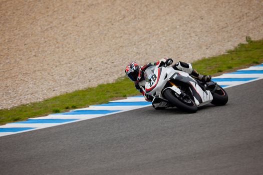 JEREZ DE LA FRONTERA, SPAIN - NOV 20: Stock Extreme motorcyclist Alejandro Rodriguez takes a curve in the CEV championship on Nov 20, 2010, in Jerez de la Frontera, Spain