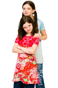 Close-up of two girls posing and smiling isolated over white