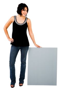 Young woman showing an empty placard isolated over white